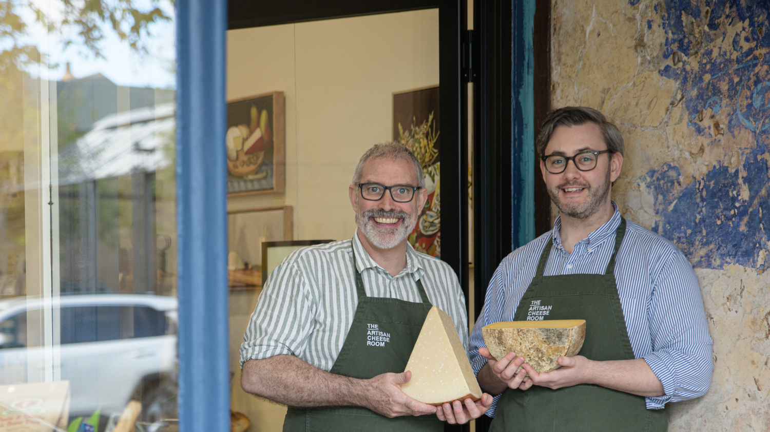Owners of The Artisan Cheese Room standing outside the shop in Paddington