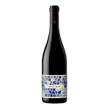 The Artisan Cheese Room Unico Zelo Delta Blue Cabernet blend wine bottle with a blue mosaic patterned label