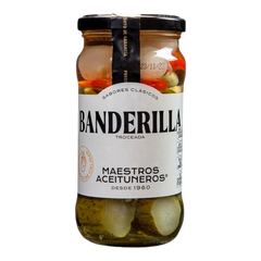 The Artisan Cheese Room Maestros Banderilla jar containing sliced pickles and peppers in brine