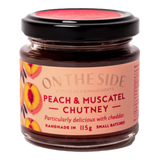 The Artisan Cheese Room On The Side peach and muscatel chutney in a small glass jar with a black lid.