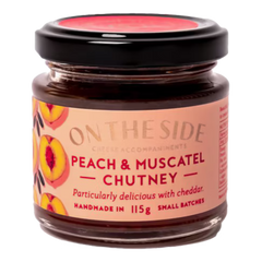 The Artisan Cheese Room On The Side peach and muscatel chutney in a small glass jar with a black lid.