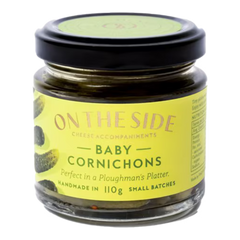 The Artisan Cheese Room jar of On The Side baby cornichons with a green label on a white background