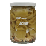 The Artisan Cheese Room Acide pickled green tomatoes in a glass jar with garlic and cassia bark