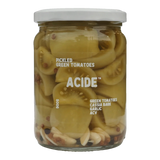 The Artisan Cheese Room Acide pickled green tomatoes in a glass jar with garlic and cassia bark