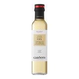 The Artisan Cheese Room Gardeny Cava vinegar in a clear glass bottle with a black cap and elegant cream label.