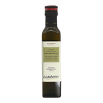 The Artisan Cheese Room Gardeny Chardonnay vinegar in a tall glass bottle with a cream label and red cap