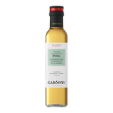 The Artisan Cheese Room Gardeny Poma apple vinegar in a clear glass bottle with a black cap and elegant label.