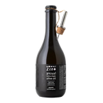 The Artisan Cheese Room Mount Zero Picual extra virgin olive oil in a dark glass bottle with a metal pourer attached.