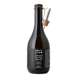 The Artisan Cheese Room Mount Zero Picual extra virgin olive oil in a dark glass bottle with a metal pourer attached.