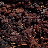 The Artisan Cheese Room Muscatels on the Vine, dark dried grapes presented in a white lined box