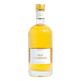 The Artisan Cheese Room Maybe Sammy Old Fashioned cocktail in a ribbed glass bottle with gold cap and white label.