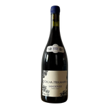 The Artisan Cheese Room Oscar Hermann Estate Sangiovese 2023 red wine bottle with a blue wax seal on a wooden table.