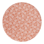 The Artisan Cheese Room Le Jacquard Francais round pink placemat with white Japanese kimono-inspired floral pattern.