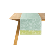 The Artisan Cheese Room Le Jacquard Francais Wagara green cotton table runner with Japanese-inspired floral motifs.