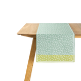 The Artisan Cheese Room Le Jacquard Francais Wagara green cotton table runner with Japanese-inspired floral motifs.